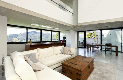 Photo: beautiful modern house in cement, interior, living room beautiful modern house in cement, interior, living room