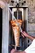 Doner kebab on it's special skewer.