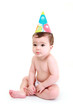 Grumpy baby wearing party hat