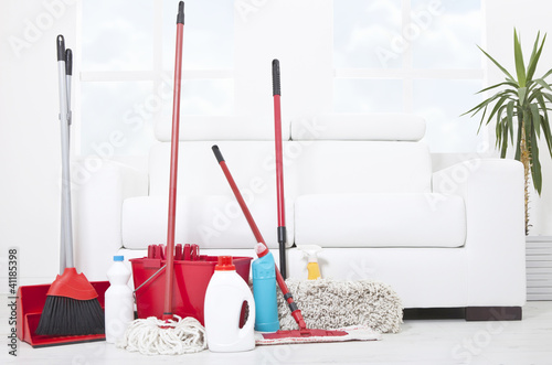 Photo: Collection of cleaning products and tools in living room Collection of cleaning products and tools in living room