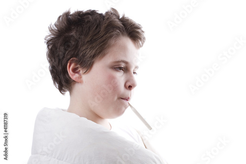 Photo: Young patient with fever in profile, with digital thermometer an Young patient with fever in profile, with digital thermometer an