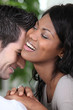 Young couple laughing intimately