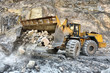 Wheel loader machine unloading rocks Wheel loader machine unloading rocks