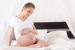 Pregnant woman sits on swing. Pregnant woman sits on swing.