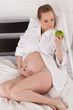 Pregnant woman with apple. Pregnant woman with apple.