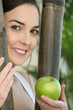 young woman holding an apple young woman holding an apple