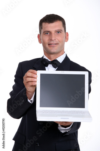 Photo: Man presenting laptop Man presenting laptop