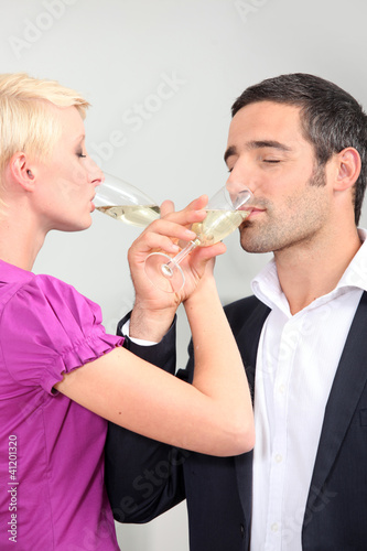 Photo: man and woman drinking champagne with love man and woman drinking champagne with love