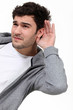 canvas print picture - Casual man struggling to hear