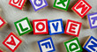 Wooden blocks forming the word LOVE in the center
