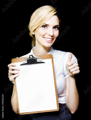 Photo: Beautiful woman holding blank clipboard Beautiful woman holding blank clipboard