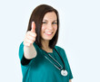 Smiling medical female doctor showing thumbs up gesture isolated