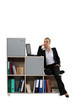 Woman sitting on a modern bookcase Woman sitting on a modern bookcase