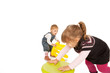 two baby girls playing in white studio