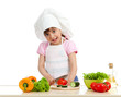 Funny chef girl preparing healthy food over white background