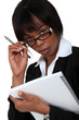 Businesswoman peering over her glasses