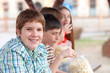 Handsome chubby teenager spending time with his friends outdoor