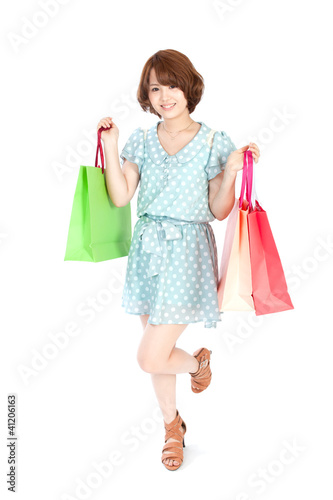 Photo: Beautiful shopping woman. Portrait of asian woman. Beautiful shopping woman. Portrait of asian woman.