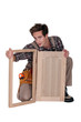 Carpenter with a cupboard door