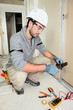Electrical engineer snipping wire Electrical engineer snipping wire