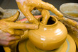 hands of a potter, creating an earthen jar on the circle hands of a potter, creating an earthen jar on the circle
