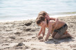 two children playing on beach two children playing on beach