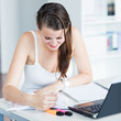 pretty female college student studying in the university library