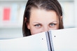 pretty female college student studying in the university library
