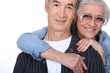 Elderly woman hugging her husband