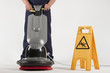 cleaning floor with machine