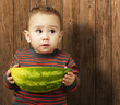 handsome boy holding a watermelon handsome boy holding a watermelon