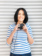 happy teenage girl in big headphones