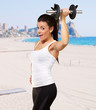 portrait of a young pretty woman holding weights and doing fitne portrait of a young pretty woman holding weights and doing fitne