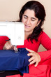 Hispanic woman working on a sewing machine Hispanic woman working on a sewing machine