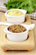 French mustard sauce in white gravy boat