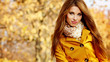 Beautiful elegant womanin autumn park
