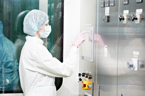 Photo: pharmaceutical factory worker pharmaceutical factory worker