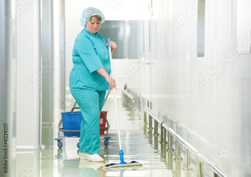 Photo: Woman cleaning hospital hall Woman cleaning hospital hall