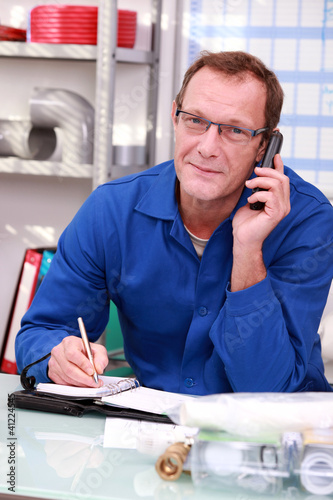 Photo: Craftsman on the phone Craftsman on the phone