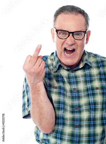Photo: Image of a displeased man showing middle finger Image of a displeased man showing middle finger