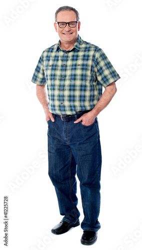 Photo: Joyful senior man posing casually Joyful senior man posing casually