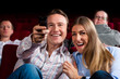 Couple and other people in cinema Couple and other people in cinema