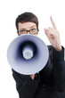 Young business lady screaming to loudspeaker Young business lady screaming to loudspeaker