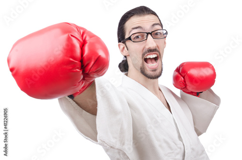 Photo: Karate fighter isolated on the white Karate fighter isolated on the white