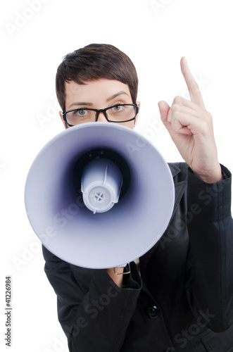 Foto: Young business lady screaming to loudspeaker Young business lady screaming to loudspeaker