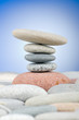 Pebbles stack against gradient background