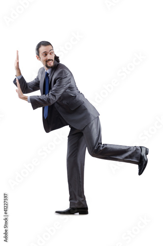 Photo: Businessman pushing away virtual obstacles Businessman pushing away virtual obstacles