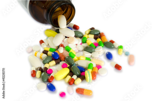 Photo: Drugs from the bottle (isolated) Drugs from the bottle (isolated)