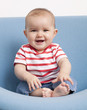 cool baby laughing on a seat