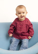 joyous baby girl standing up